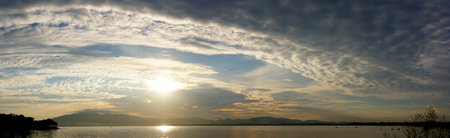 Panoramic view of morning sky with reservoir backgroundの写真素材