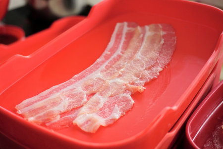 Raw food, fresh pork in red tray for boiled in hot potの写真素材