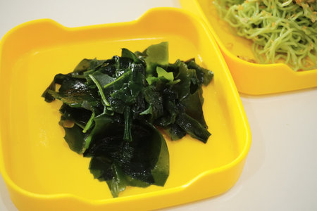 Seaweed in yellow tray for boil in hot potの写真素材