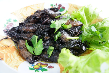 Stir fry squid with black ink, Thai seafood menuの写真素材
