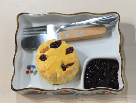 Homemade British Scones with strawberry jam in trayの写真素材