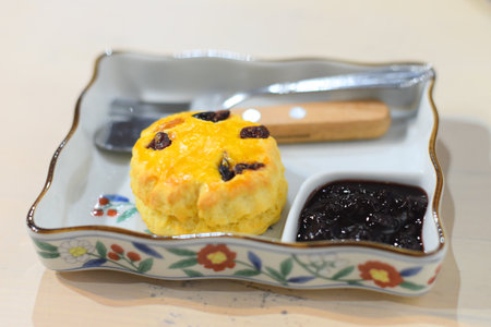 Homemade British Scones with strawberry jam in trayの写真素材