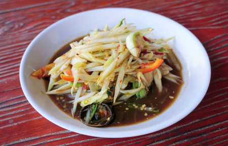 Spicy papaya salad with salty crab, Thai cuisineの写真素材