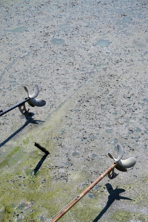 Screw-Propeller of long tail boat and low lide sea surface backgroundの写真素材