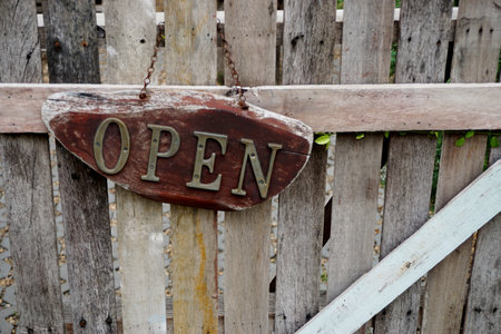 Vintage open sign at wooden fence, Decoration at entranceの写真素材