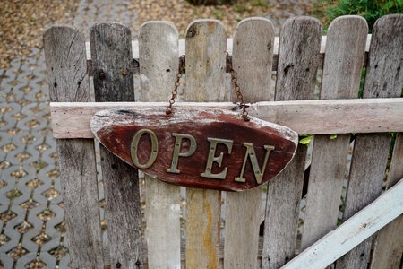 Vintage open sign at wooden fence, Decoration at entranceの写真素材
