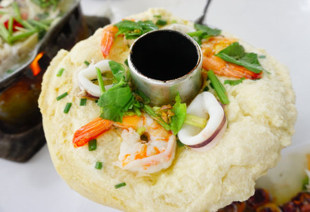 Steamed egg with seafood in hot pot, Thai cuisineの写真素材