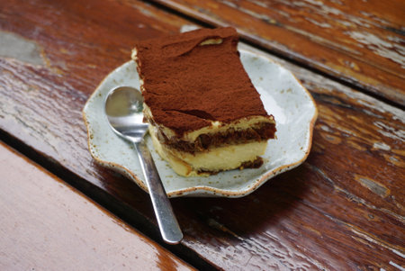 Tiramisu cake on wooden table