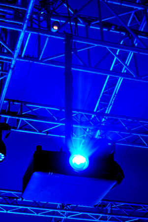 Blue beam lighting from lighting projector at ceiling , Stage lighting control