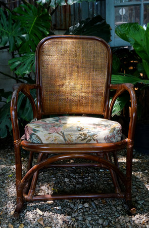 Vintage arm chair in garden with lighting shine downの写真素材