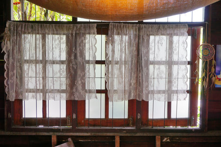 Vintage wooden window with lace curtains, Interior designの写真素材