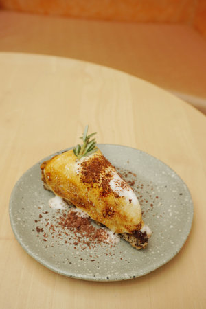 Marshmallow and chocolate cake on wooden tableの写真素材