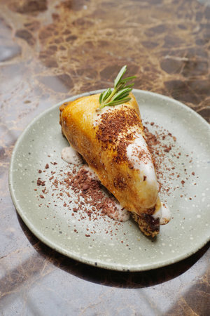 Marshmallow and chocolate cake on table