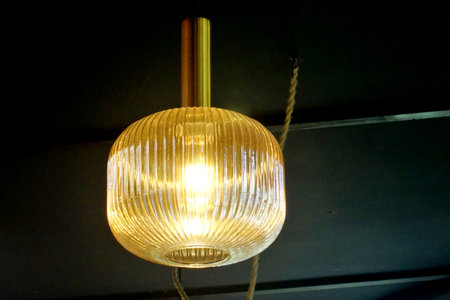 Vintage lamp hanging with dark ceiling backgroundの写真素材