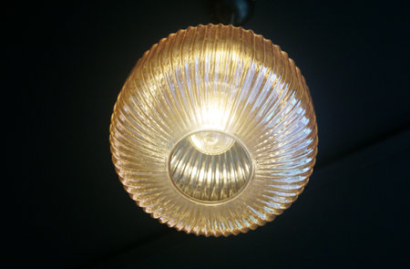 Vintage lamp hanging with dark ceiling backgroundの写真素材