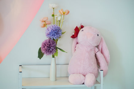Craft flower and pink rabbit door on shelf , Sweet color tone interiorの写真素材