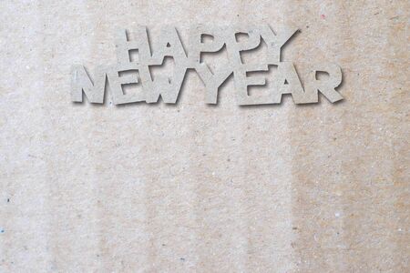 Happy New Year text on Recycled brown paper backgroundの写真素材