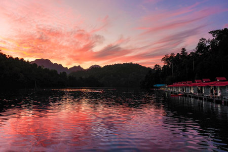 Sunset Scene with Beautiful lake and mountain background at Ratchaprapa dam , khao sok national park...