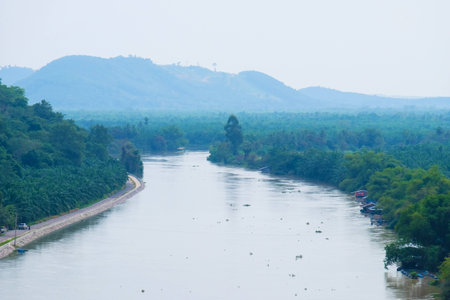 Landscape of Tapi River with mountain and forest background , Surat Thani, Thailandの写真素材