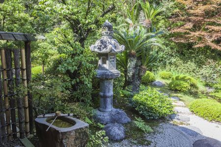 Stone lantern, path and sourceの写真素材