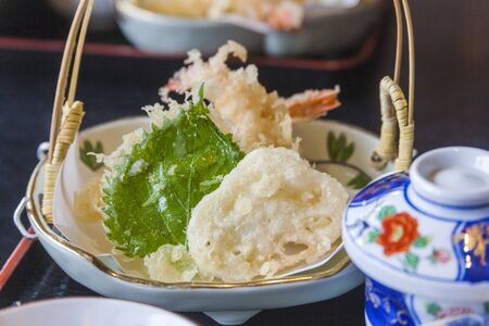 plate with tempura, shiso leaf in a japanese restaurantの写真素材