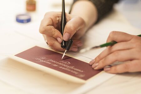 The girl is studying lettaring. Creative writing cour. Calligraphyの写真素材