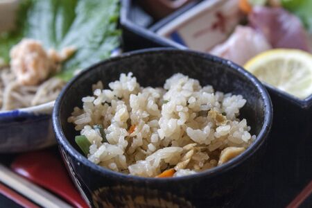 Fried rice with vegetables on a bowl, in a japanese dinerの写真素材