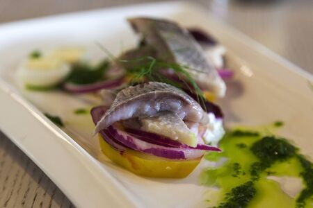 Traditional Latvian herring appetizer with pesto sauceの写真素材