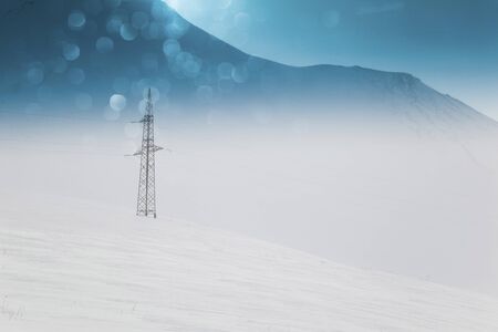 High voltage towers winter in mountainsの写真素材