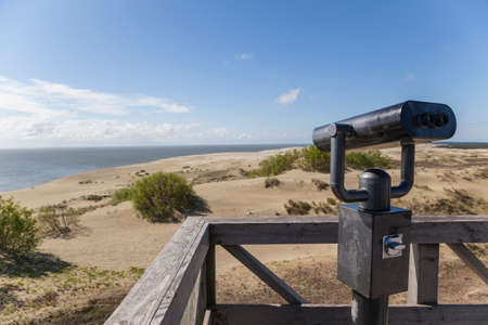 Dune Efa. Summer. Curonian Spit. Wooden observation deck with fixed observation metal binocularsの写真素材