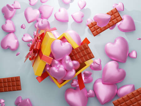 gift box falling pink heart with chocolateの写真素材