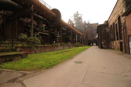 Old factory halls and pipelines in the former steelworks in the Landschaftspark Duisburg-Nordの写真素材
