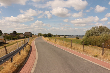Road on the Rhine dam near Vynen, in the district of Xantenの写真素材