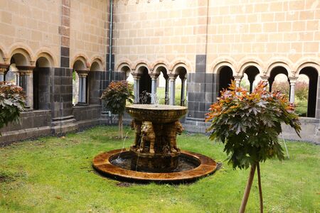 View of the Lion Fountain in the Benedictine Abbey of Maria Laach in the Eifelの写真素材