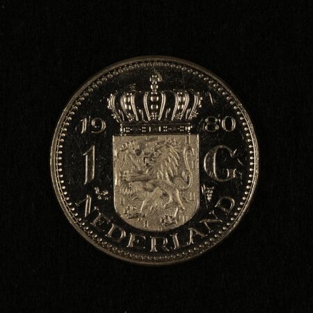 Front of a former Dutch 1 guilder coinの写真素材