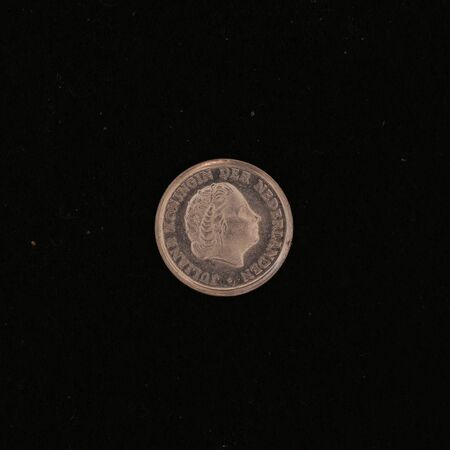 Close-up of a former Dutch 10 cent coin