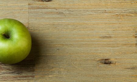 Apple on a wooden table or board backgroundの写真素材