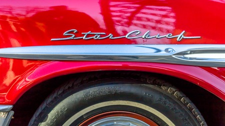TALLINN, ESTONIA - MARCH 6, 2017: Shiny red beautiful Ford Mustang Wheel Star Chick Retro Vintage Front Side Standing at Car Moto Show Exhibition Sunnyのeditorial素材