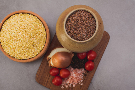 Superfood, groats & seeds, a healthy mix for a healthy lifestyle on stone neutral background