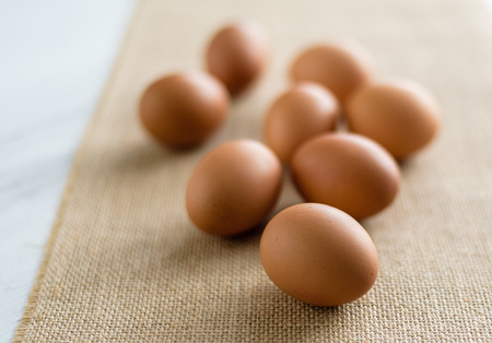 Fresh eggs in wicker basket, Prepare chicken eggs and eggs for cooking or bakery