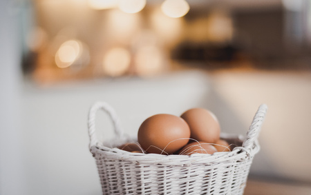 Fresh eggs in wicker basket, Prepare chicken eggs and eggs for cooking or bakeryの写真素材