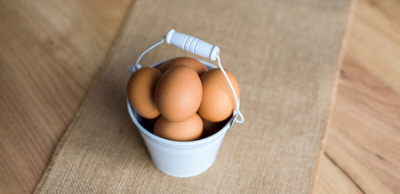 Fresh eggs in wicker basket, Prepare chicken eggs and eggs for cooking or bakery.