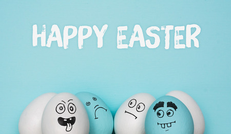 Painted Eggs with cute hand drawn funny faces. Happy easter card concept.