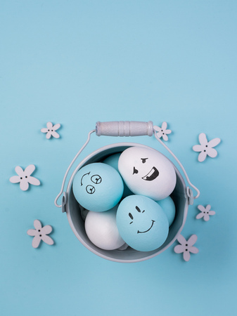 Painted Eggs with cute hand drawn funny faces. Happy easter card concept.