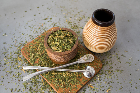 Yerba Mate tea on neutral stone gray backgrund. Healthy, energy boosting drink on neutral stone gray backgrund.の写真素材