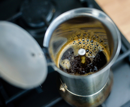 Preparing a traditional italian style coffee with coffee percolator.の写真素材