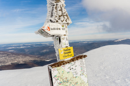 Signpost on the top of the mountain in the winter season.の写真素材