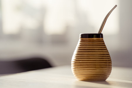 Espresso coffee cup with straw on white table in cafe.の写真素材