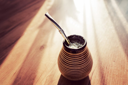 Smoking on a wooden table. Close up.の写真素材