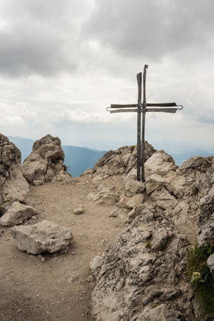 Cross on the top of a mountain in the Dolomites, Italyの写真素材